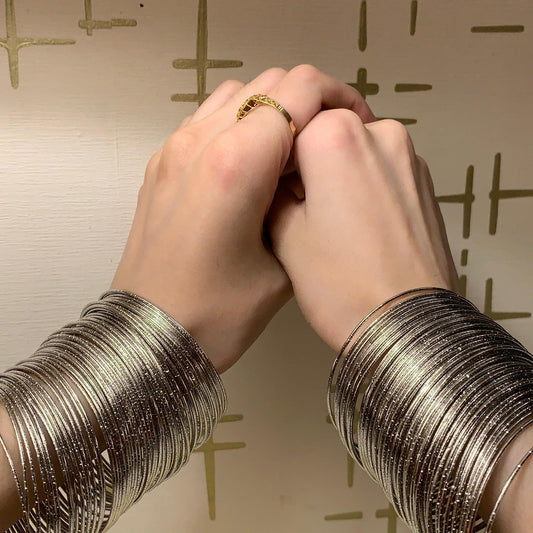 Viral silver bangles - both hands look