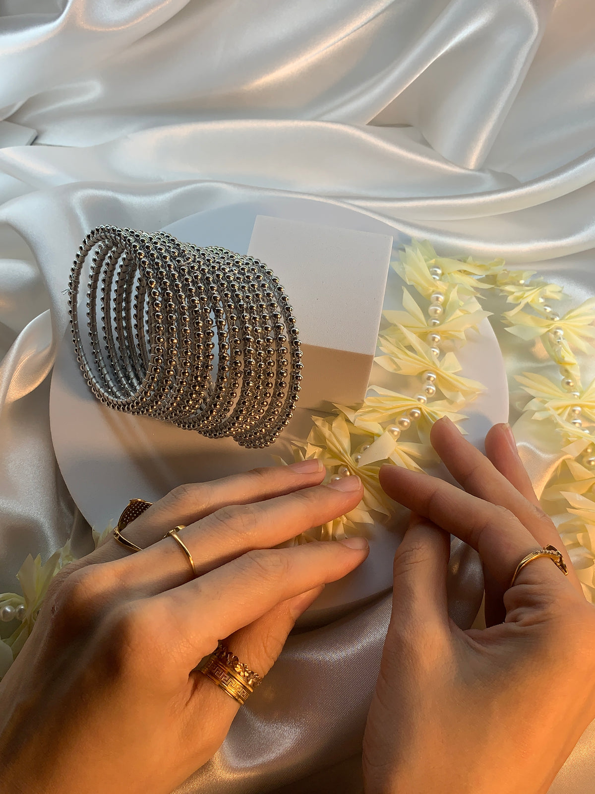 Silver Pearl bangles.