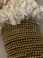 Gold Pearl bangles.