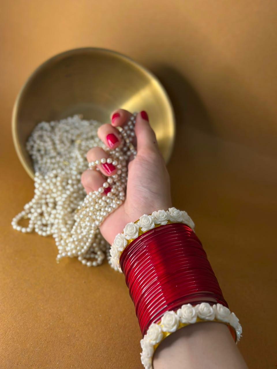 Red bangles with phool karray bundle