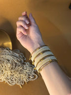 Pearl bangles with gold ghungroo bundle