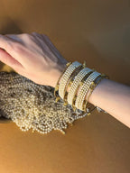 Pearl bangles with gold ghungroo bundle